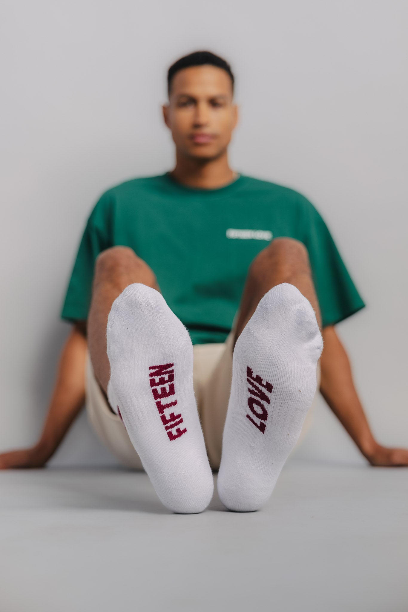 Front foot view of male tennis sock highlighting cushioning and stretch for on-court performance.